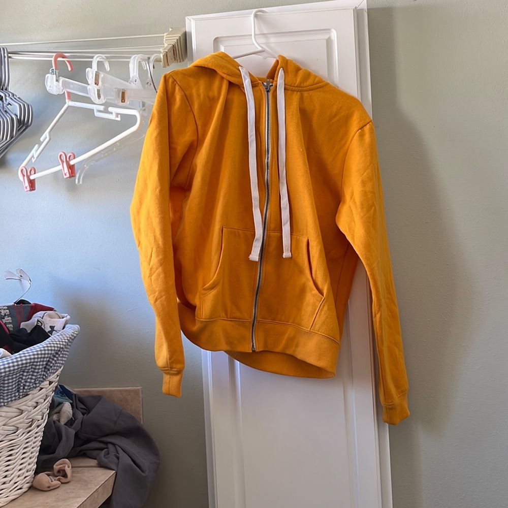 Bright yellow jacket with good. Never worn. Size large